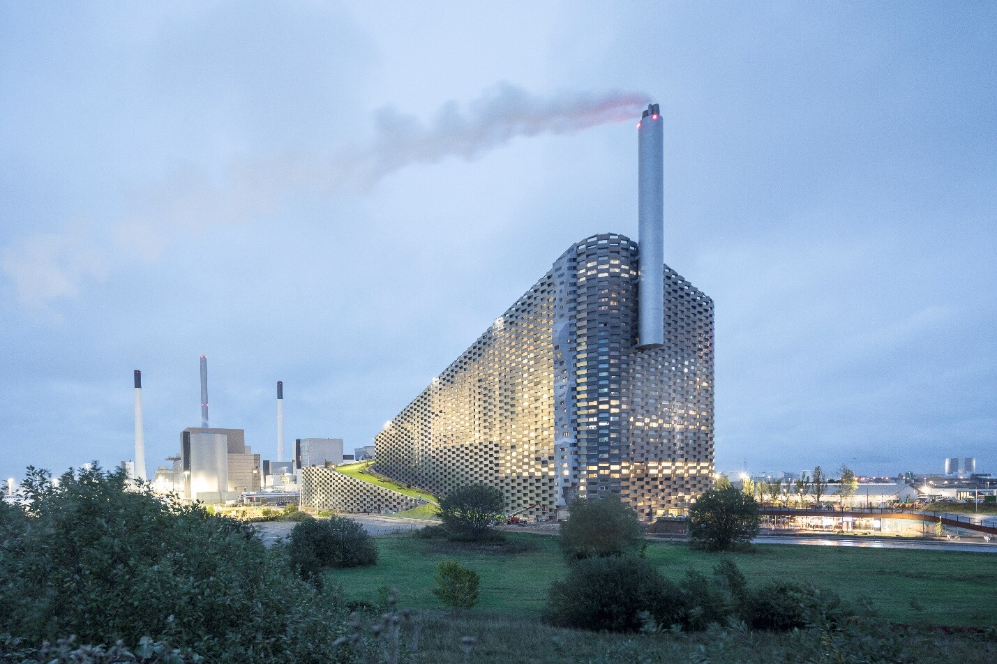 CopenHill's facade is made up of glass and stacked aluminum bricks