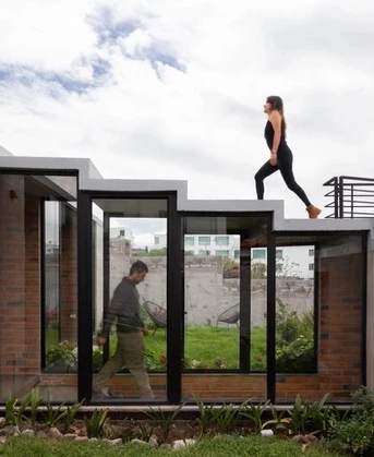 The interior pathway is replicated above the home with its walkable rooftops