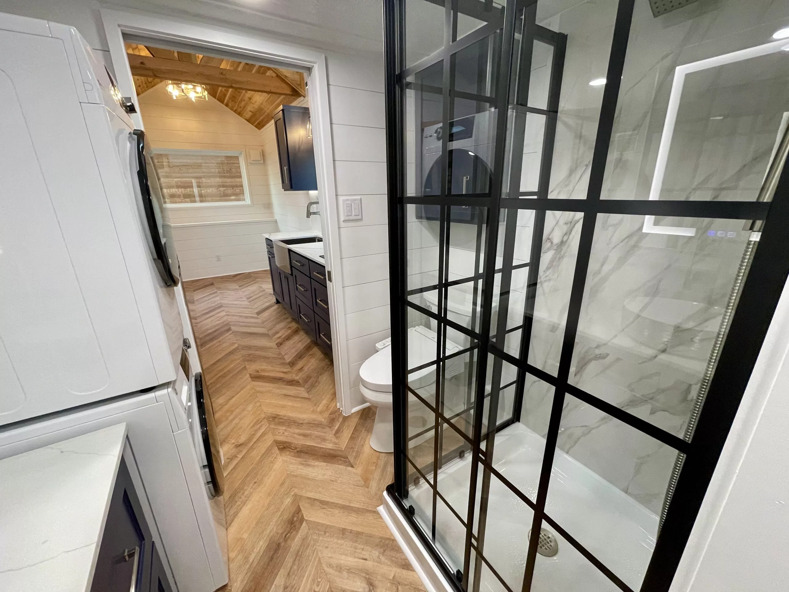 The Lady Bird's bathroom includes a shower, vanity sink, and a high-tech flushing toilet with controls for a bidet