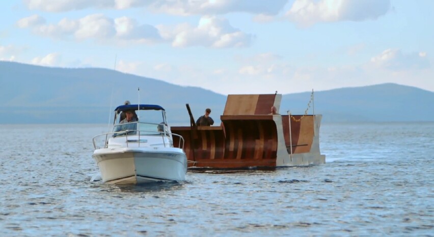 The floating ramp gets towed to location