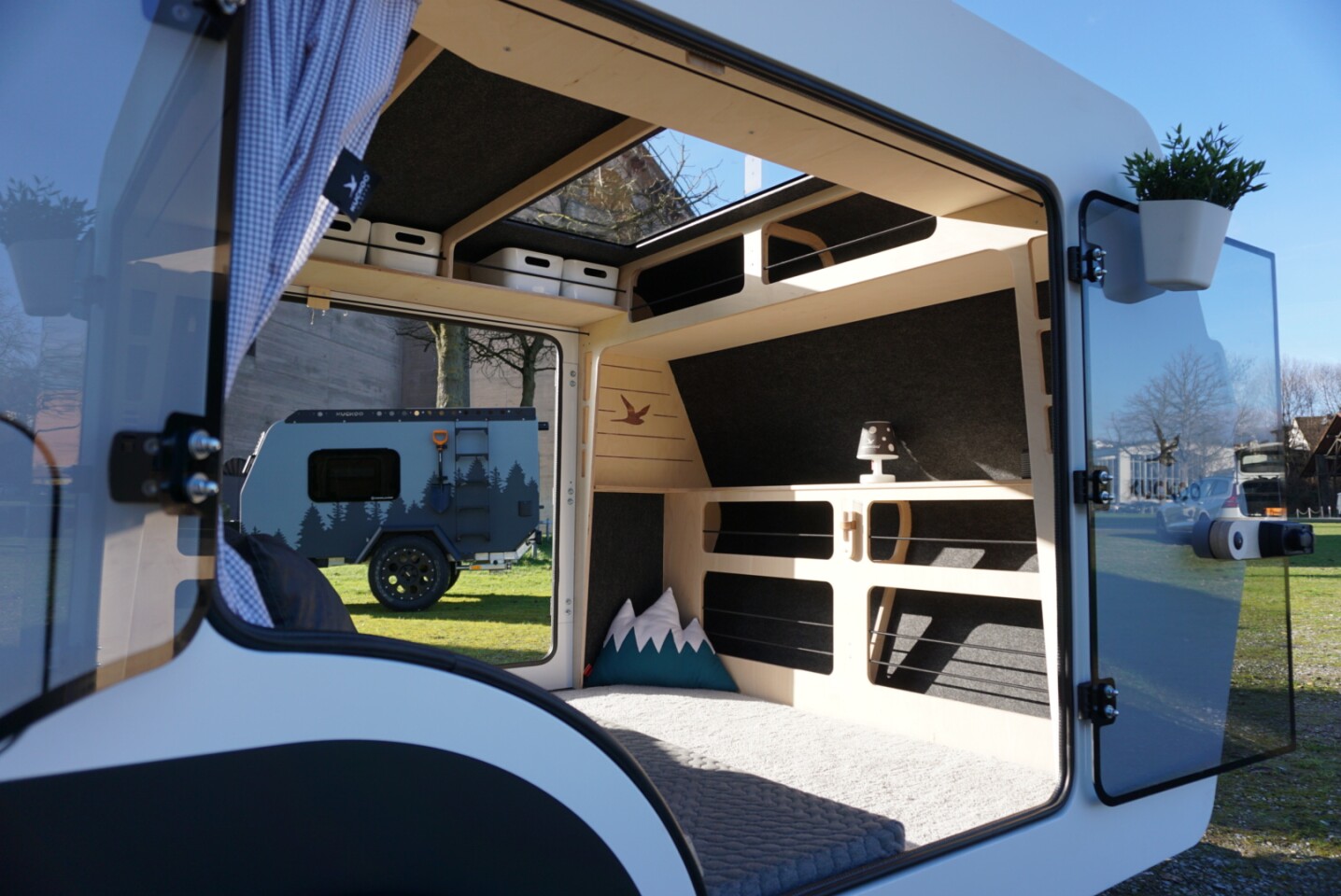 With the optional second glass door entry, the Emma Trailer becomes a breezy base camp with views in nearly every direction.