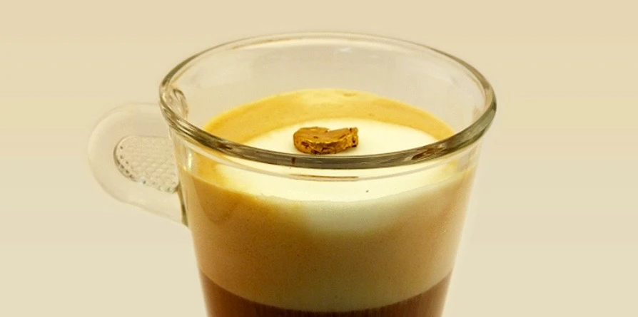 A piece of the gold foam is light enough to float atop milk froth
