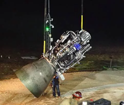 SpaceX's Raptor engine is swung into place for test-firing