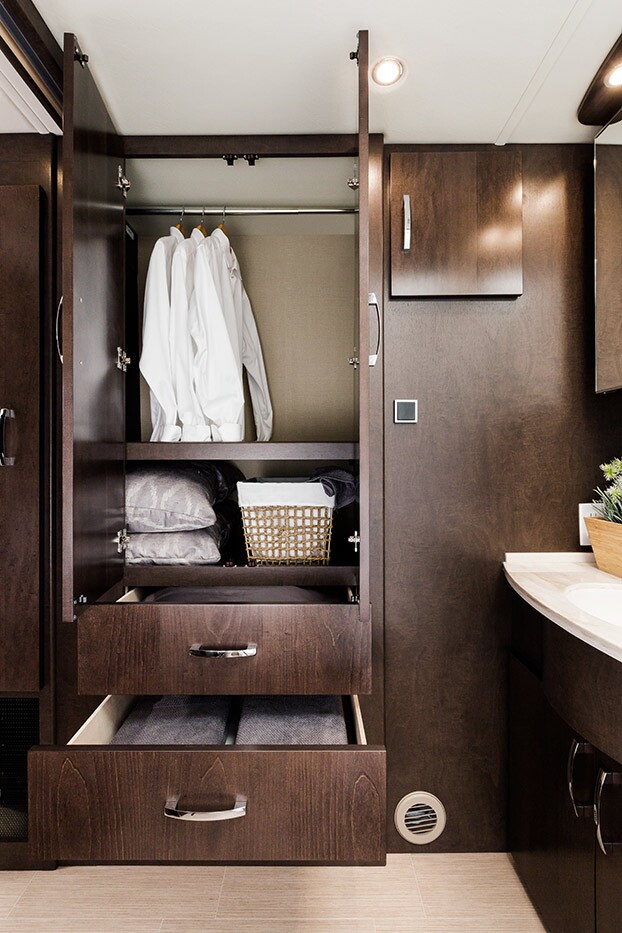Unity motorhome combines Murphy bed and swivel recliners in comfy
