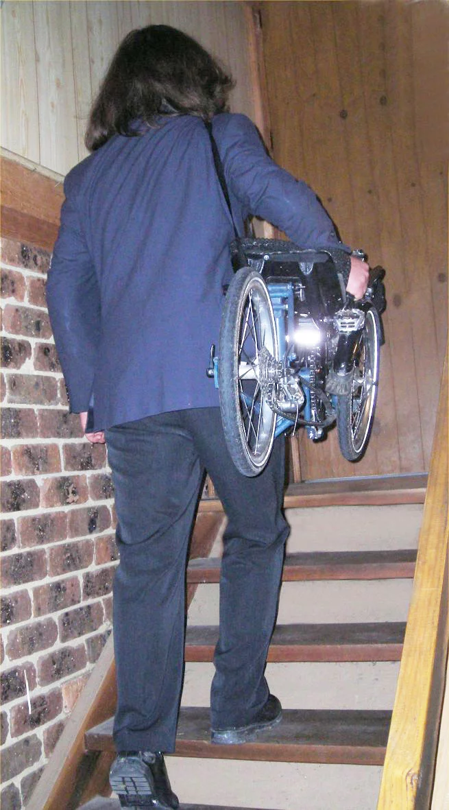 The Evolve trike, being toted after folding