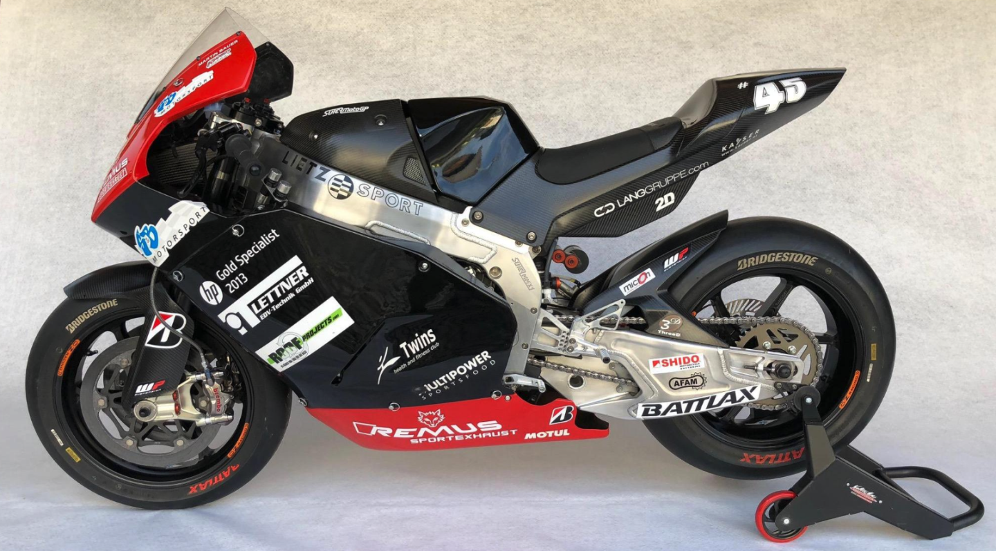 This Suter MMX1 was ridden during the 2012 MotoGP season by American Colin Edwards and is one of the few machines to have consistently brief 'Claiming Rule Teams' (CRT) era. Faced with escalating costs and dwindling participation, Dorna came up with a lower-cost category that ran alongside the factory prototypes. The idea was that CRT teams would run production-based engines in prototype chassis, and that engines would be claimable by factory teams for a set fee of €25,000, though why a factory team would want to acquire a tuned road-bike engine was never explained. In the event, none ever did. This bike runs a BMW engine, and scored eight points scoring finishes during the season, with a high of eleventh place at the Malaysian Grand Prix. The bike sold for $60,000 Auction Description