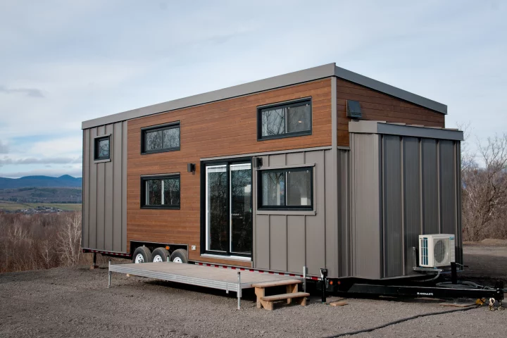 The Charme V2 measures 36 ft (10.9 m) in length and is finished in cedar, with steel accenting