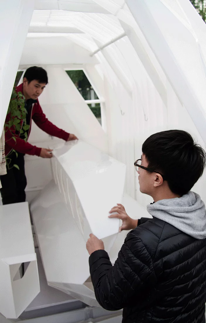 The sink, stove, and bath all collapse into the front wall