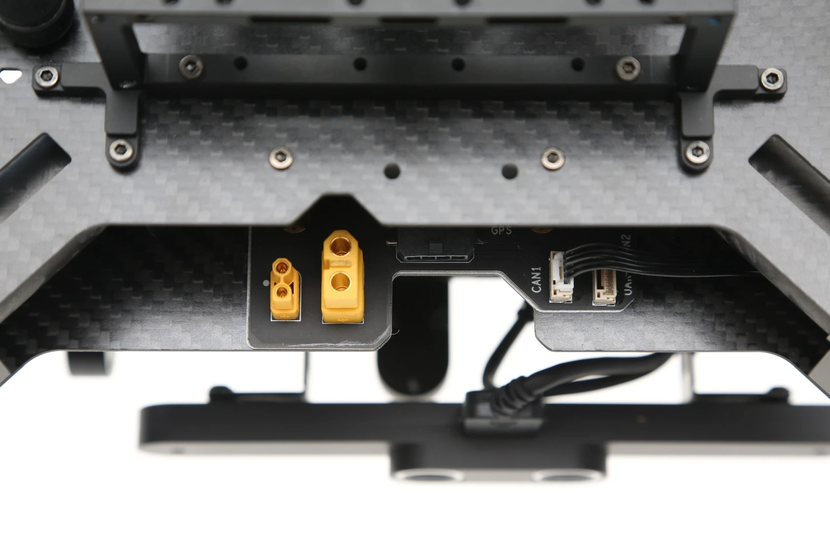 he Matrice 100 features several communication ports, power supply leads and expansions bays for extras components, so that additional hardware can be fixed to the drone to afford it new functionality