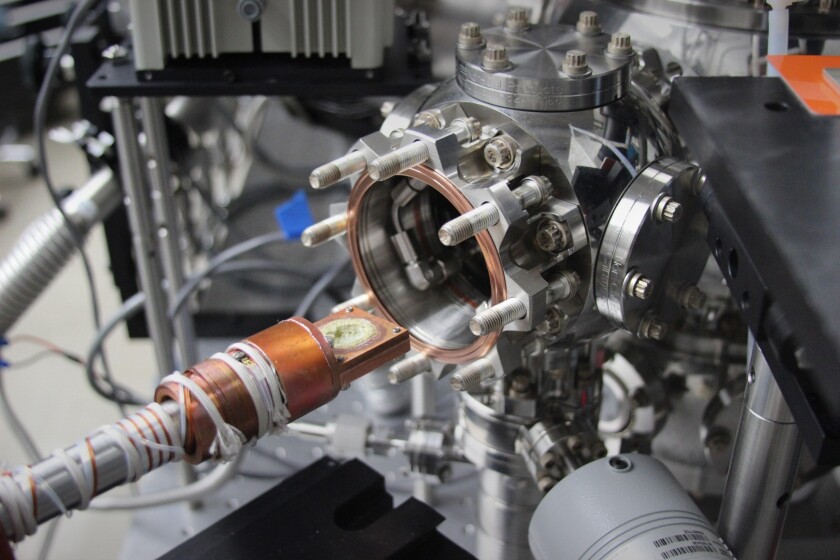In a laboratory simulating conditions on Jupiter's moon Europa at JPL, plain white table salt (sodium chloride) turned yellow