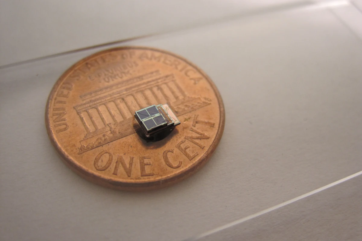 A low-power sensor system developed at the University of Michigan is 1,000 times smaller than comparable commercial counterparts. It could enable new biomedical implants. Photo (Daeyeon Kim)