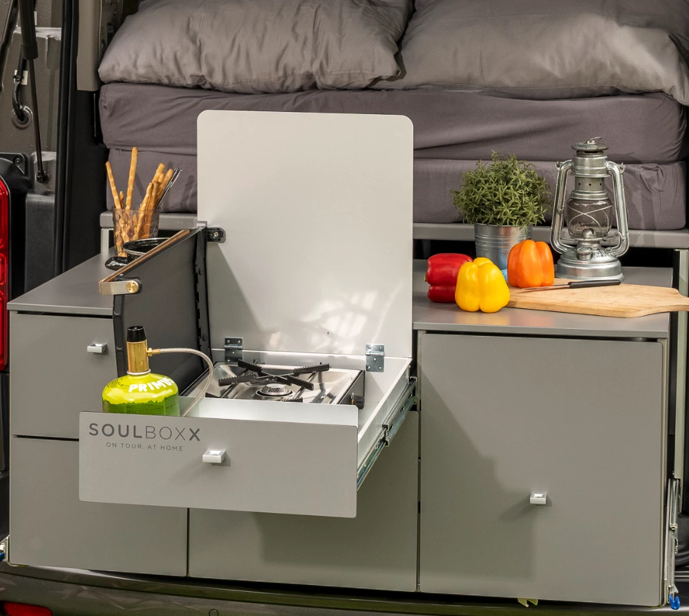 The SoulBoxx camper kit houses a stove, fridge, sink and sleeping platform that convert the EQV to a camper and remove easily from the van