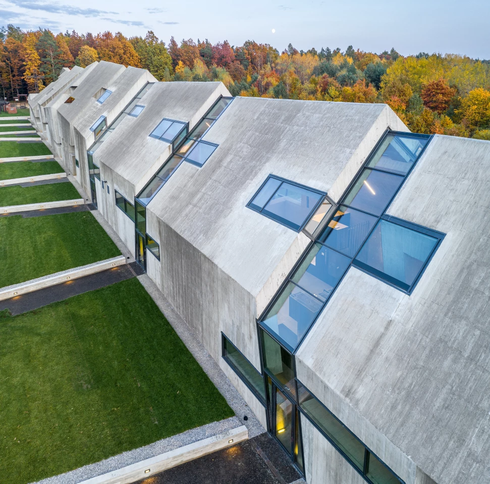 The Mausoleum of Martyrdom of Polish Villages in Michniów is primarily constructed from concrete