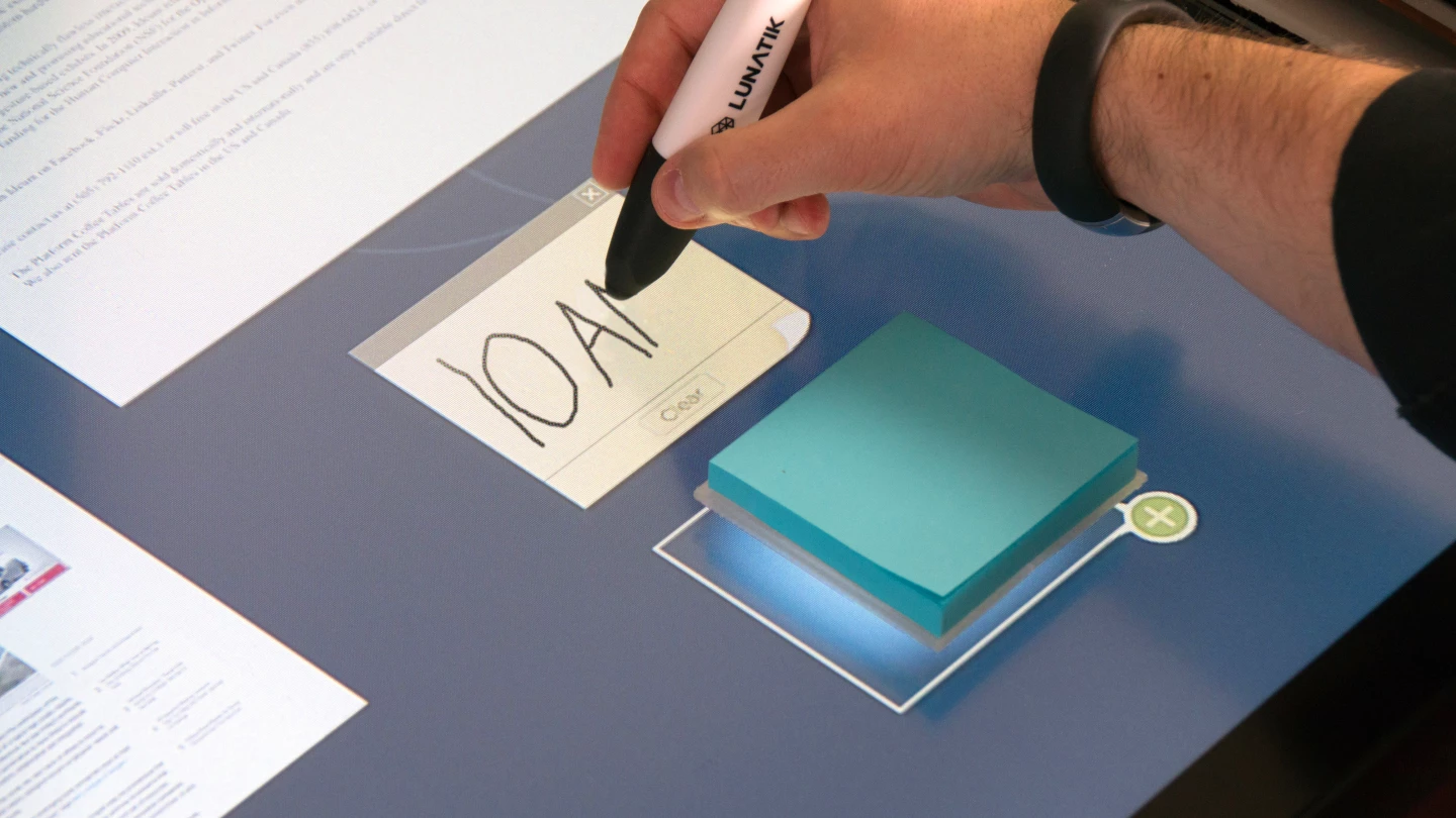 Put down a real sticky notepad to bring up a virtual notepad interface (Photo: Ideum)