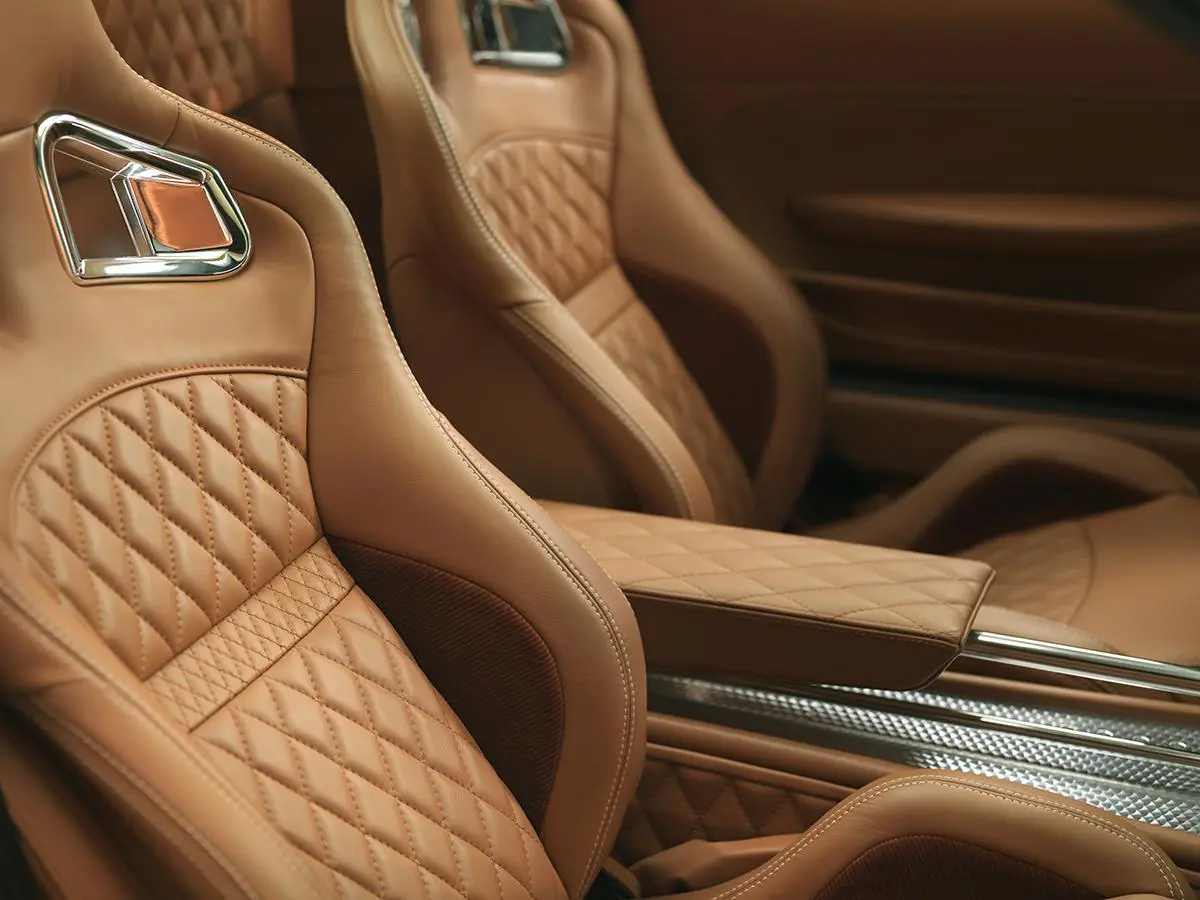 Spyker uses high-end leather, aluminum and aero-styled controls to create a unique look