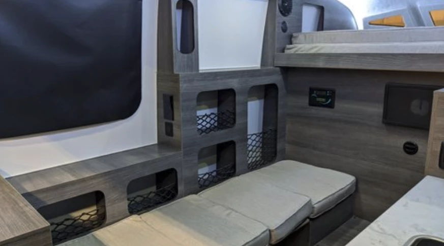 The lowered table and bench seats convert into a small bed at night