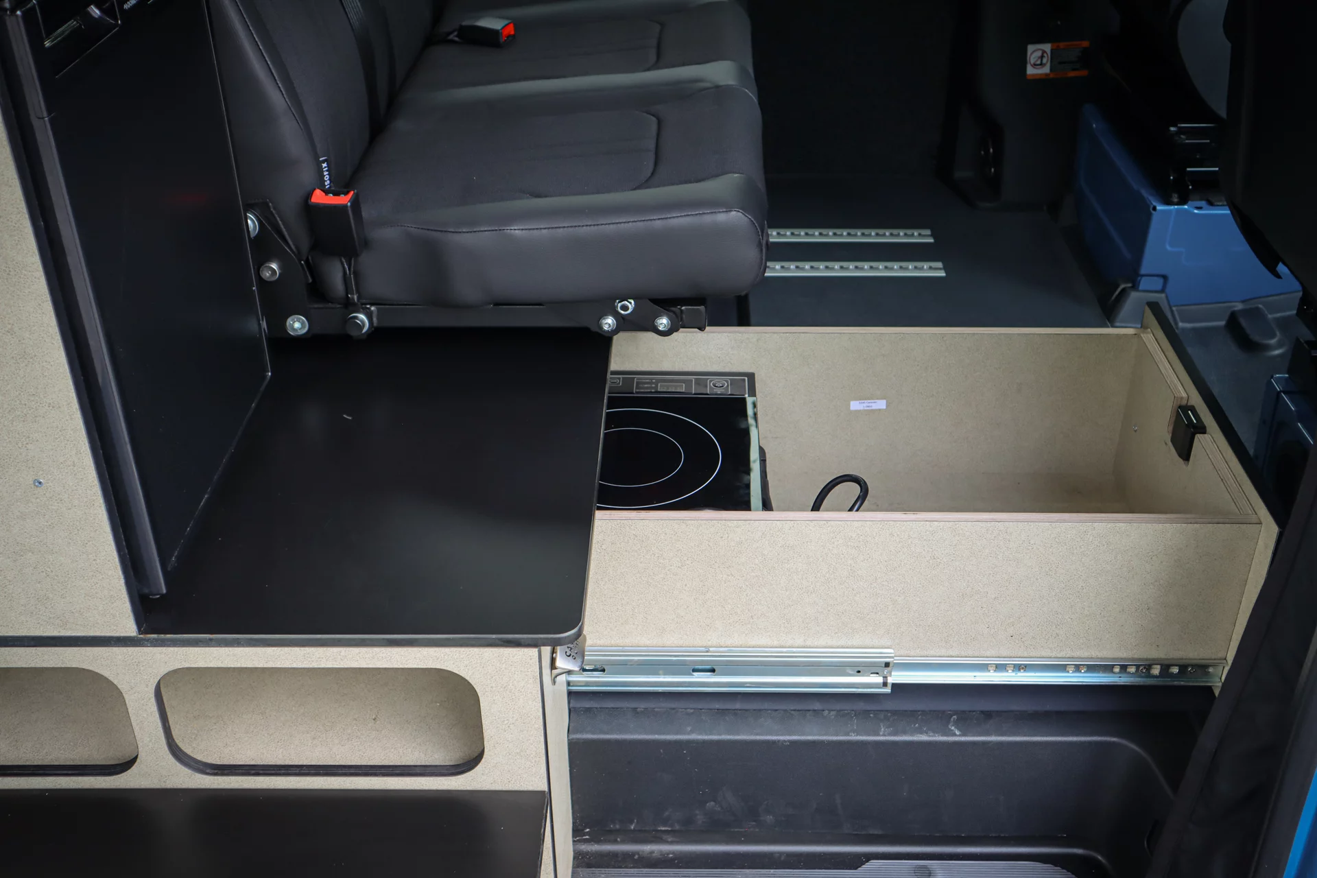 The Alpaca includes a portable induction cooktop for indoor and outdoor use