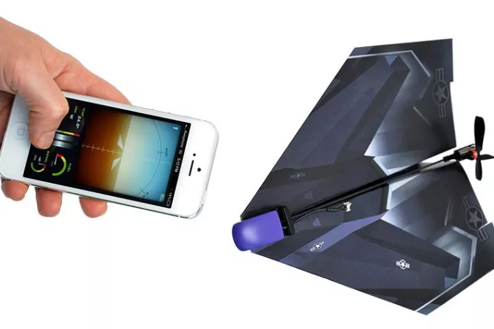 A paper airplane equipped with the PowerUp 3.0 kit, which is controlled via PowerUp's flight control app