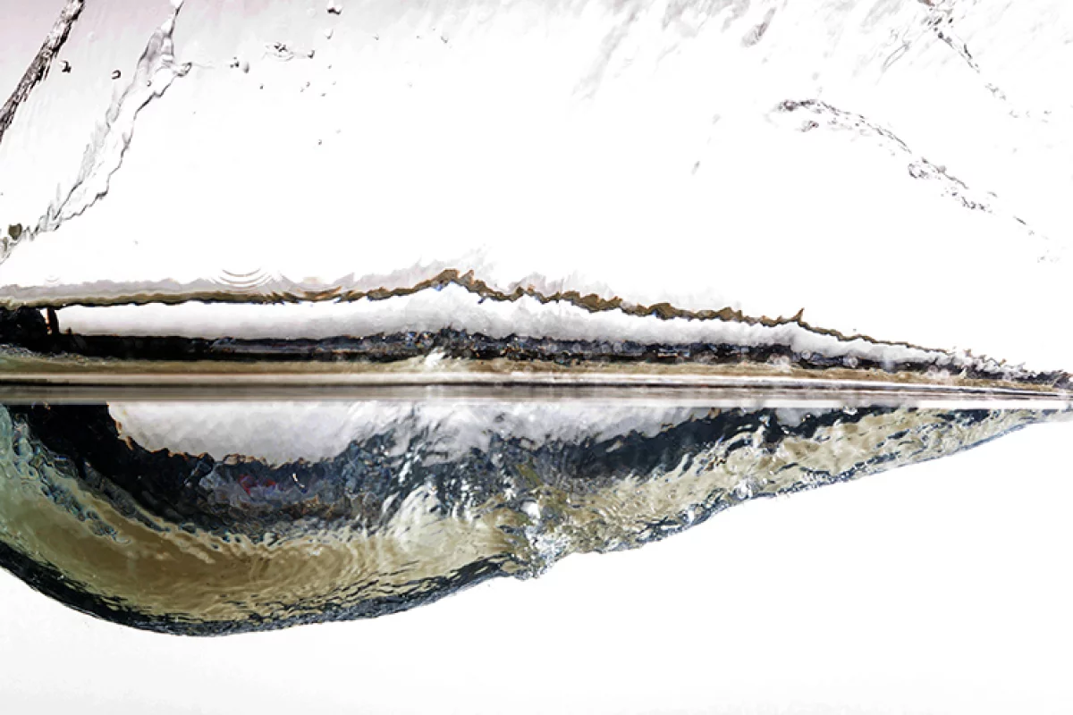 Why exactly do elastic spheres skip so much better than stones?