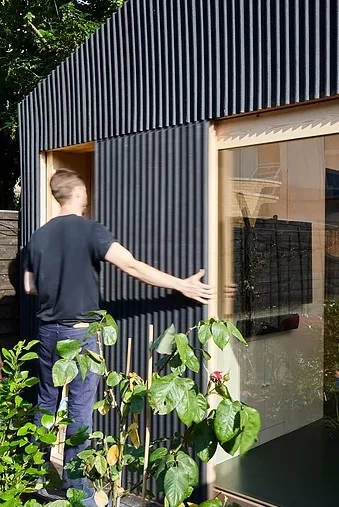 The Light Shed is fitted with bespoke timber and glass sliding doors, connecting the studio to Andrews' backyard garden