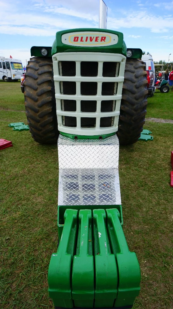 1964 Oliver Competition Tractor. The green and red metal plates are weights used to counterweight the pulling load