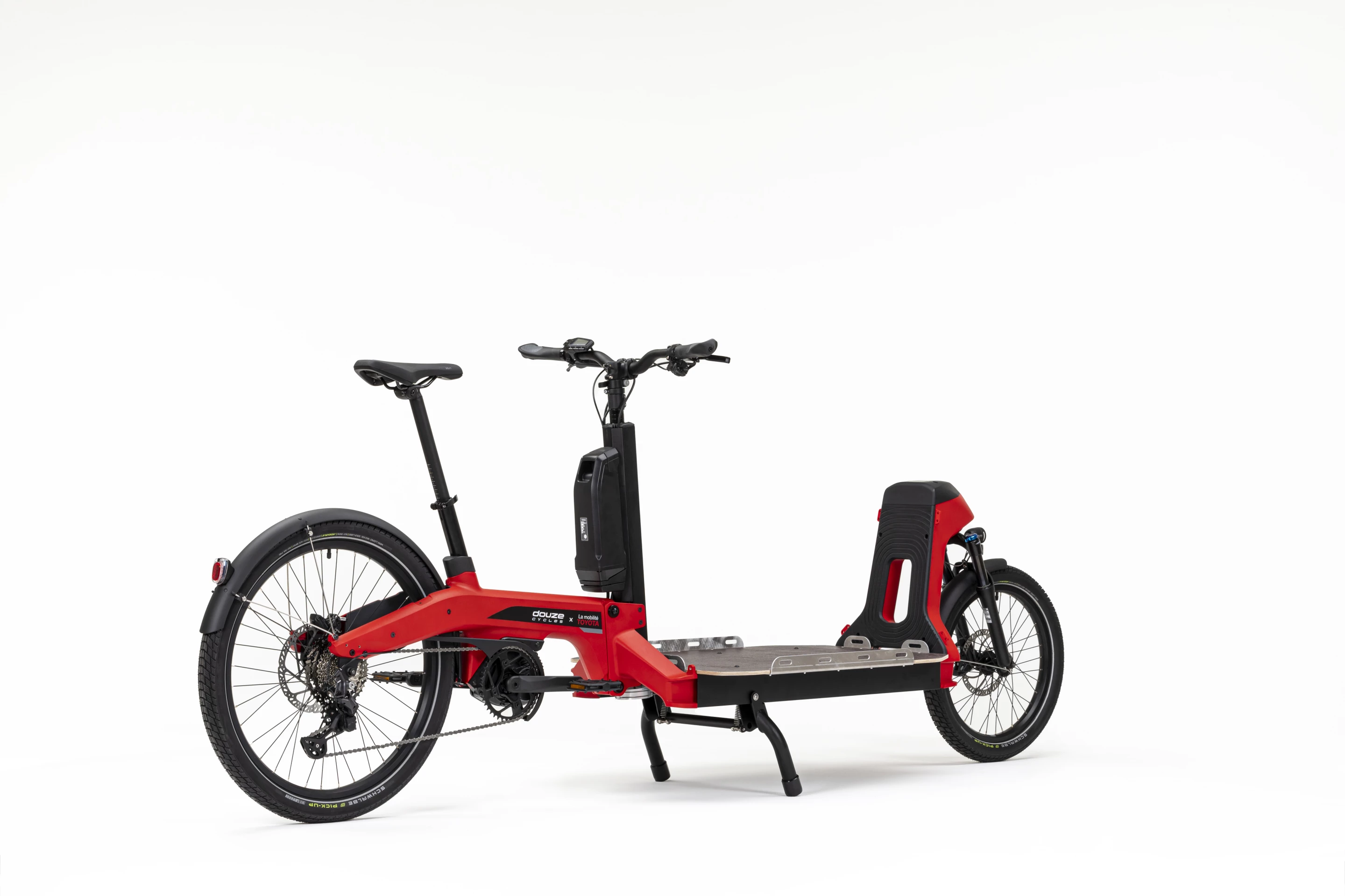 The Douze Cycles x La mobilité Toyota cargo ebike can separate into front and rear frame parts for easy storage or between-haul transport on a suitable bike rack