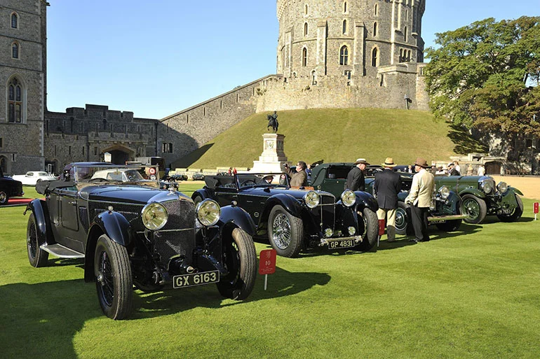 Vintage Bentleys lined up in front of Windsor Castle