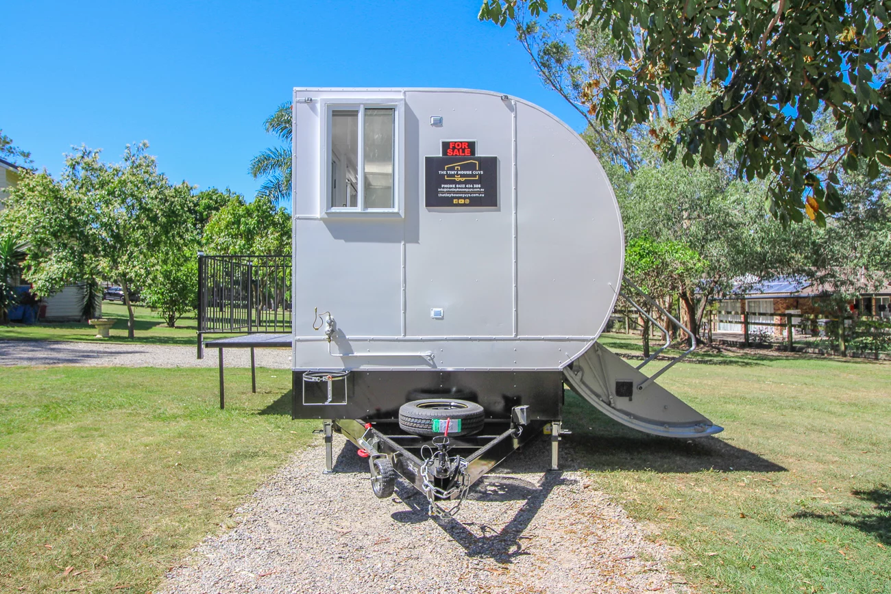 The Aero Tiny gets power from a solar panel array and has a water tank and pump system mounted under the floor