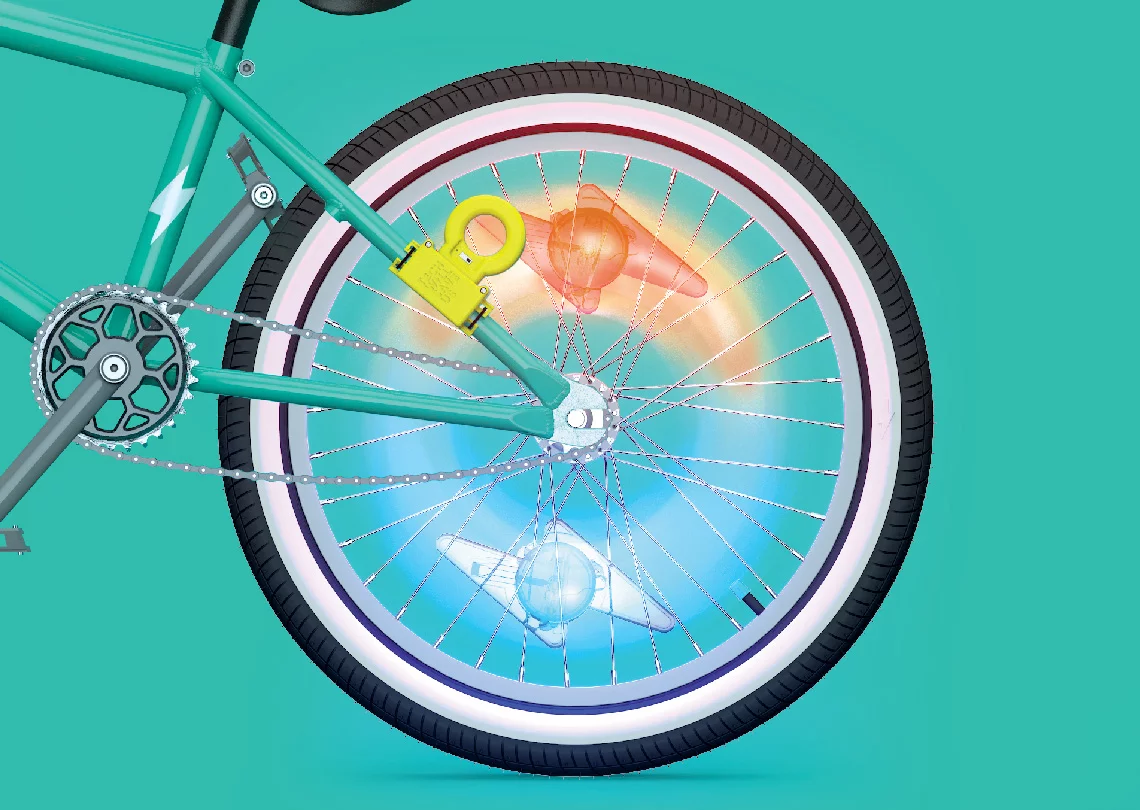 As the lightning bolt-shaped bike lights pass the wireless power emitter of the Light Racer kit , they illuminate