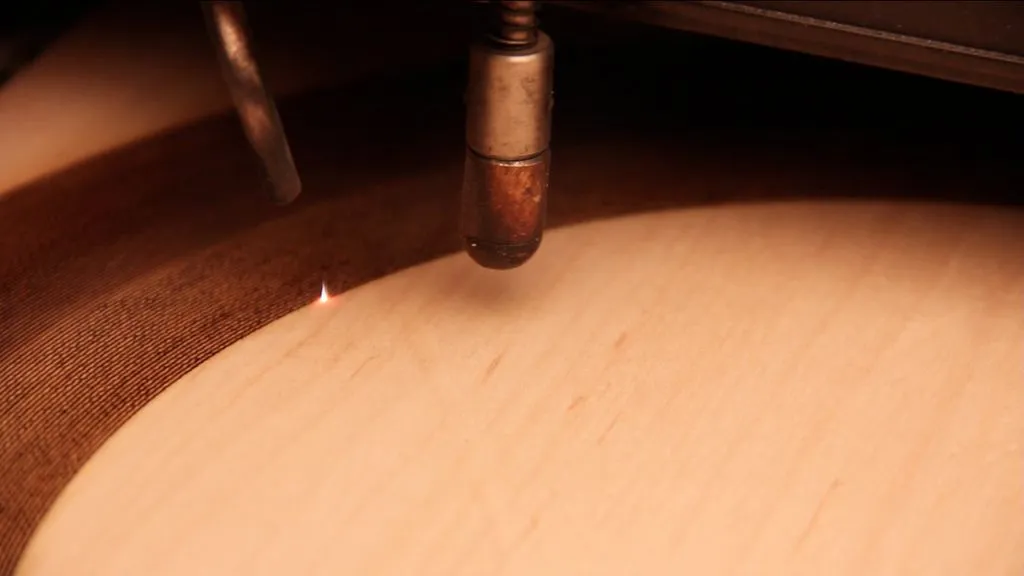 Ghassaei cut her wooden records onto a sheet of maple with an Epilog 120 Watt Legend EXT at an approximate precision of 1200dpi