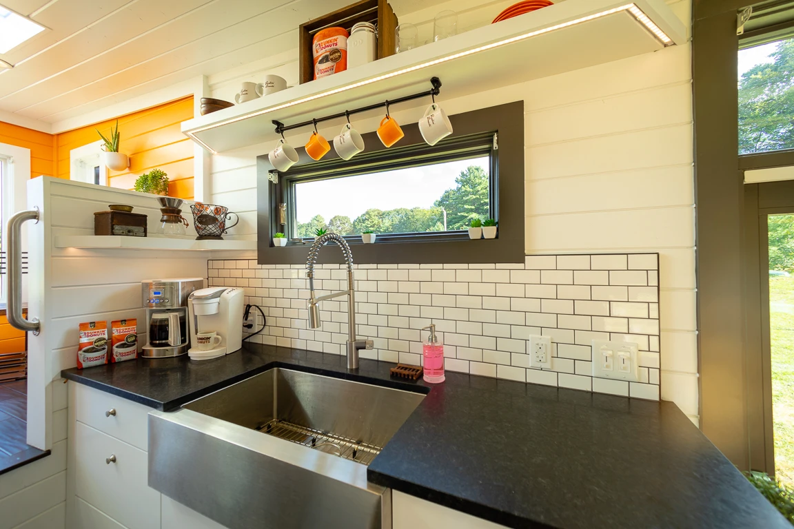 The Home That Runs on Dunkin's kitchen is finished in subway tiles and features slate countertops