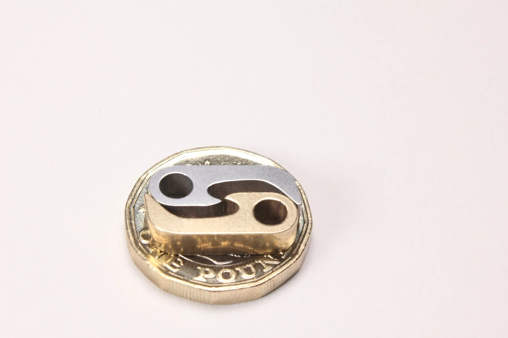 Malboro & Kane’s metallic Claw multitool is smaller than a penny