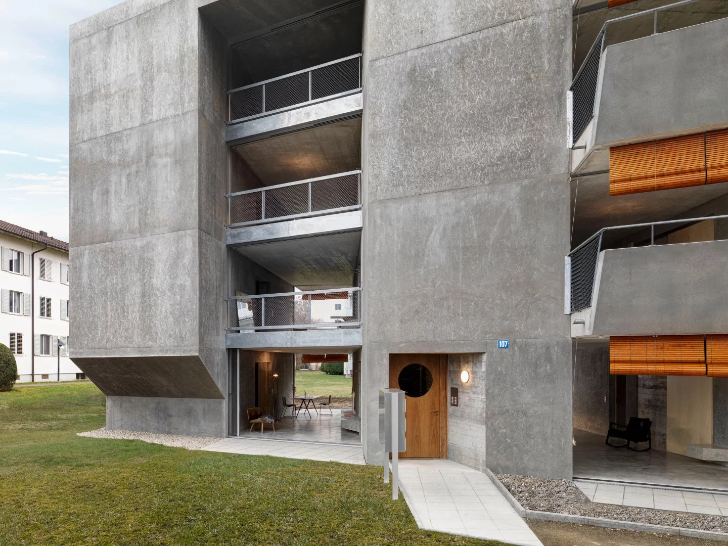 Affordable Housing Langgrütstrasse's balconies feature wooden blinds