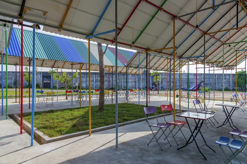 Inside, it features a classroom, health station, theater, and public showers and bathroom