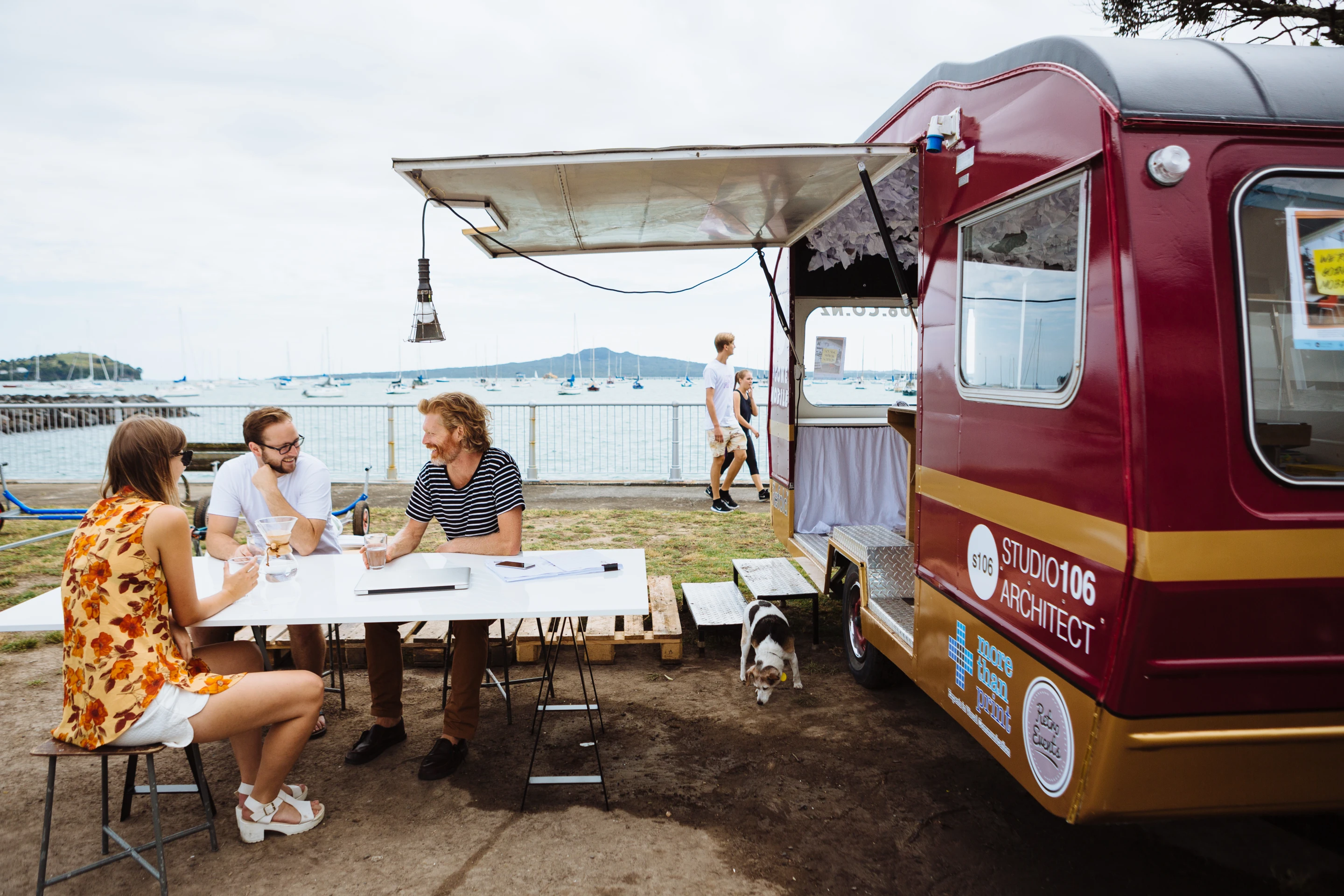 Project discussions around the outdoor meeting table
