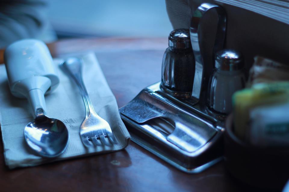 The Liftware Spoon alongside a regular fork