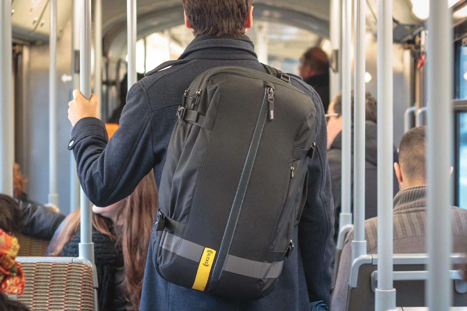 The Slicks bag worn with one strap while the other is stored