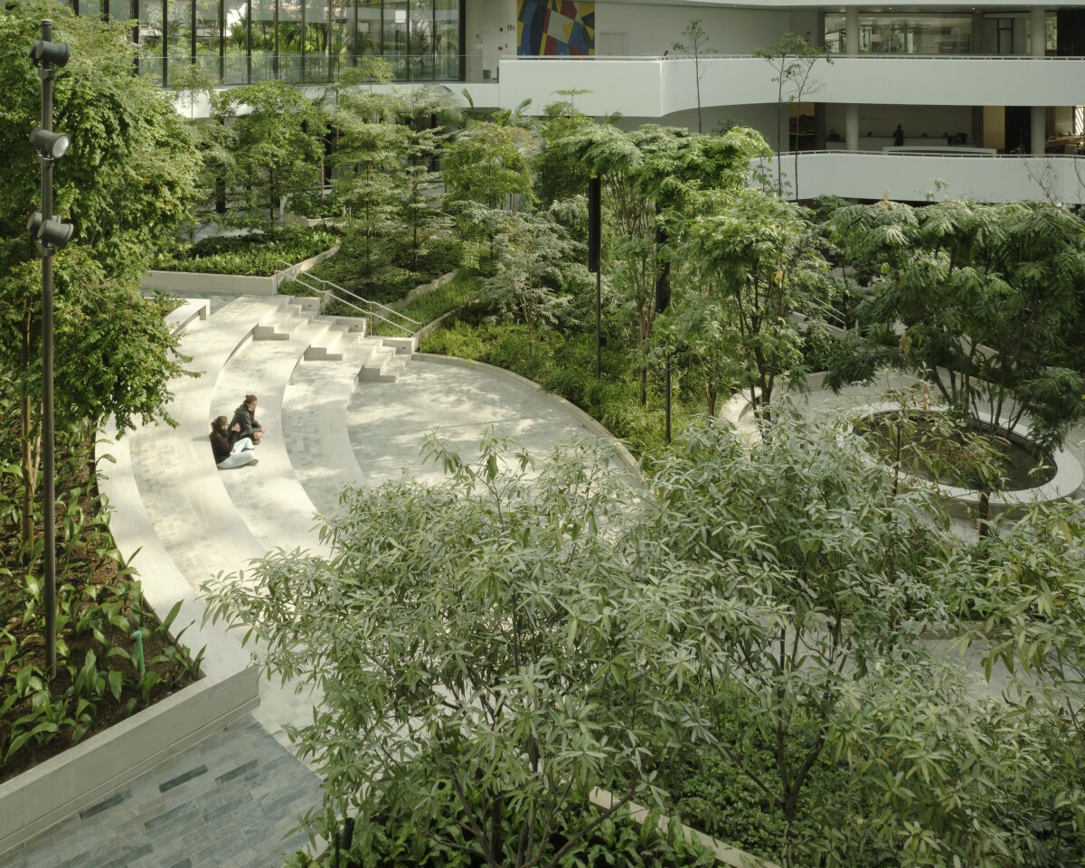 The Albert Einstein Education and Research Center's greenery filled atrium includes over 150 different types of trees and plants