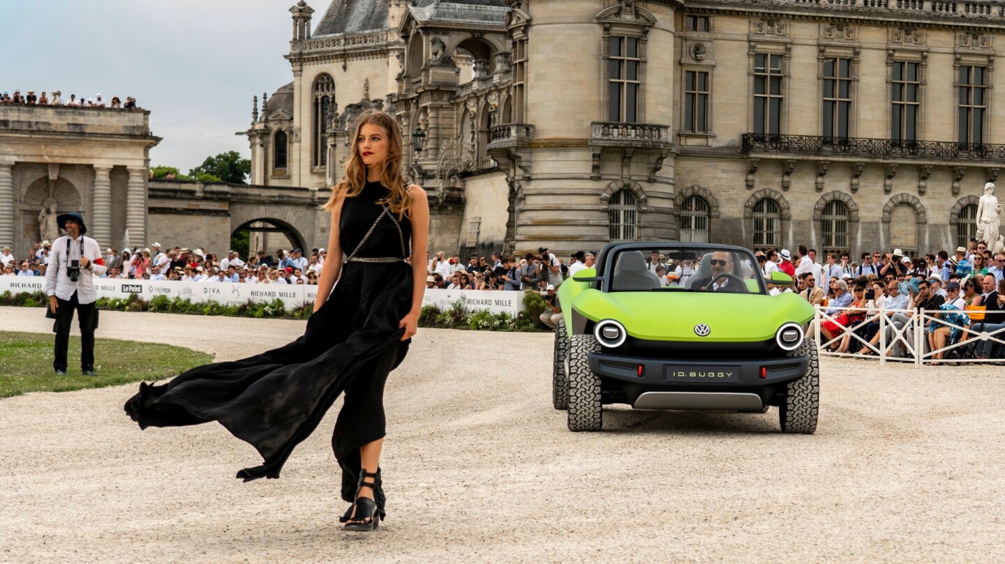 The Volkswagen ID. Buggy with model dressed by Ann Demeulemeester