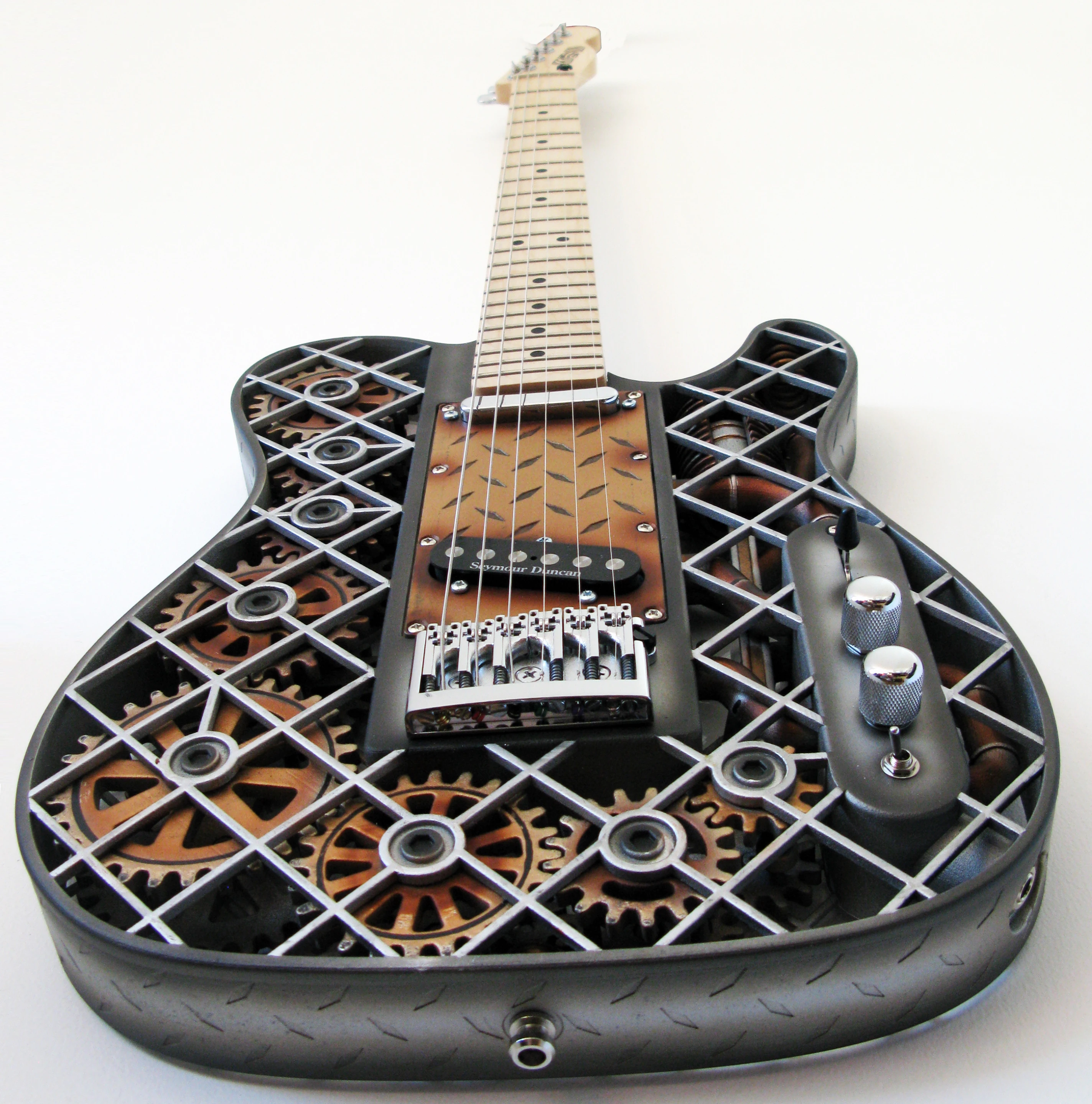 The switch to the back of the tone and volume pots activates the moving gears and piston