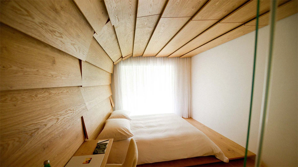 The Therme Vals project in Switzerland, by Kengo Kuma & Associates, is a set of apartments renovated to house hotel staff, with the designers aiming to create space filled with "warmth and intimacy"