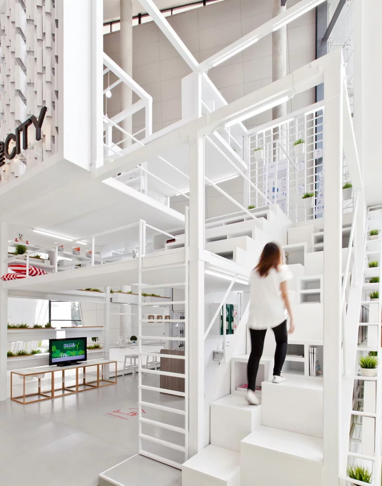 The living space contains two main floors, two mezzanines, and a vertical garden