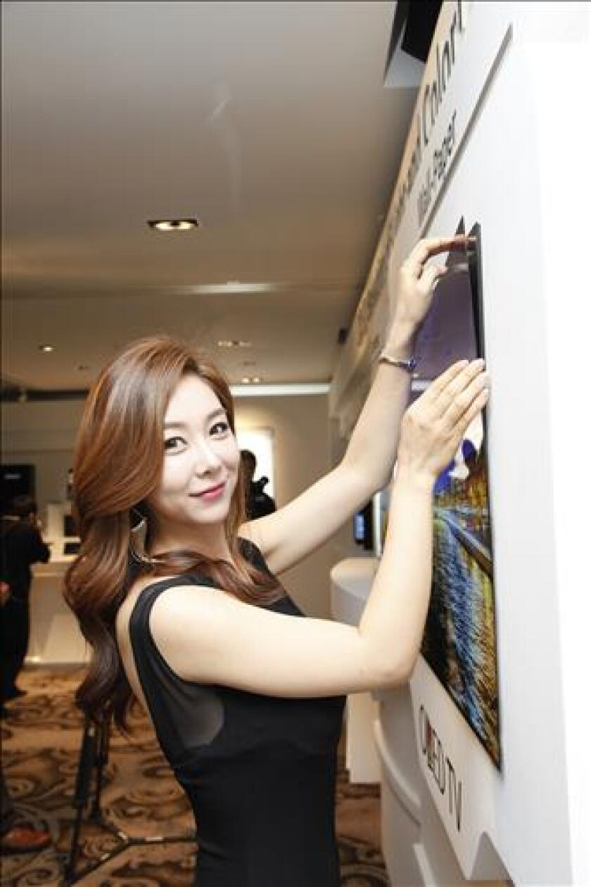 LG's 55-inch "wallpaper OLED" panel is just 0.97 mm thick and weighs 1.9 kg (4.1 lb)