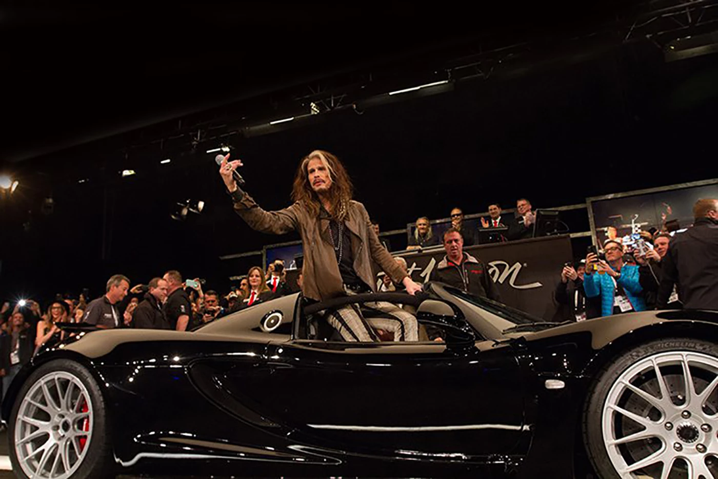 This year the top charity seller during the Scottsdale week was the Hennessey Venom GT Spyder owned by Rock and Roll Hall of Fame inductee and four-time Grammy winner Steven Tyler (lead singer of Aerosmith). The Hennessey Venom GT Spyder weighs 1258 kg, and the mid-engined twin turbo 427 ci (7.0 liter) V8 produces 1,244 hp (928 kW), and has been timed at 265.6 mph (427.4 km/h). Tyler ordered the first one at a cost of $1.1 million in 2012 and the car fetched $800,000 for the charity Janie's Fund. Tyler put on quite a show for the crowd and it was a selfless act to give away a car of such significance for the greater good.