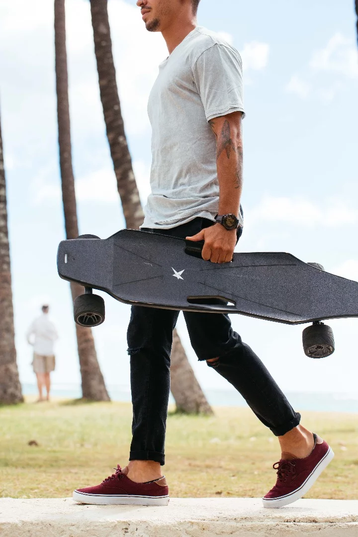 The StarkBoard's deck has useful carry holes for between rides