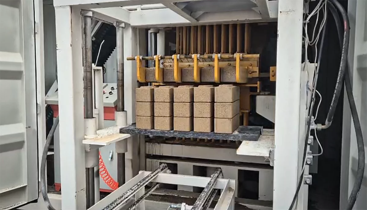 The mobile brick factory neatly stacks the bricks as it pops them out