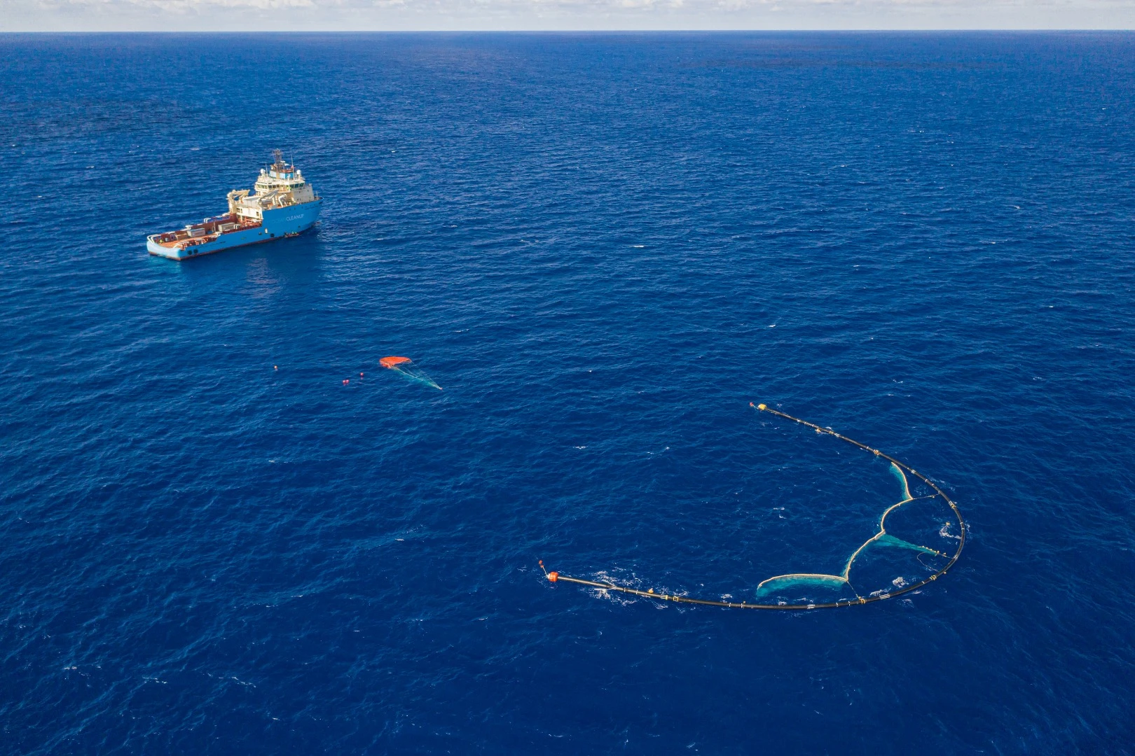 The Great Ocean Cleanup team envisions fleets of its U-shaped barrier drifting through the Great Pacific Garbage Patch eating up plastic waste like a giant Pac-Man