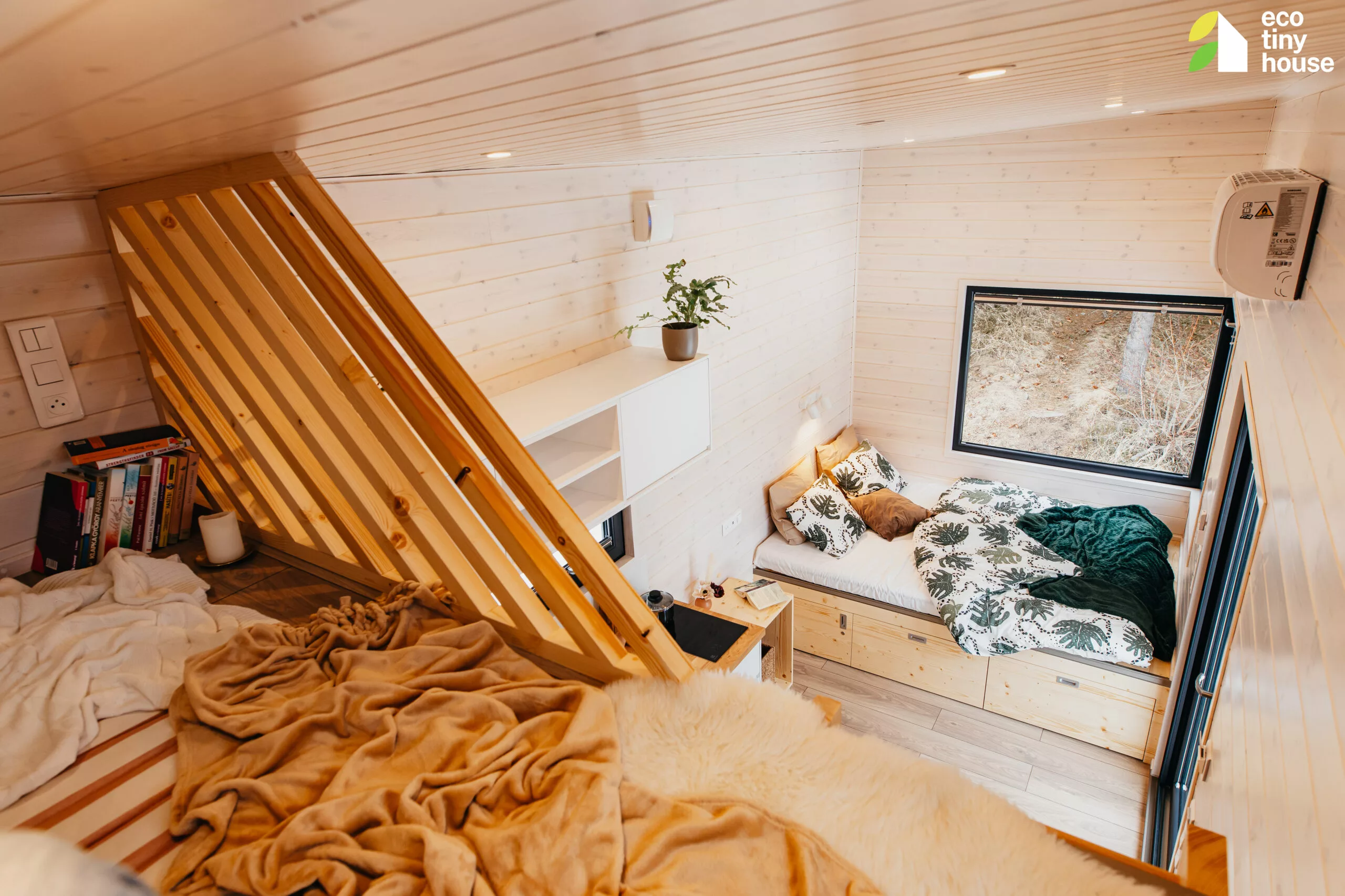 The Tiny Rubik's loft area is suitable for use as a bedroom, for storage, or as a hangout space