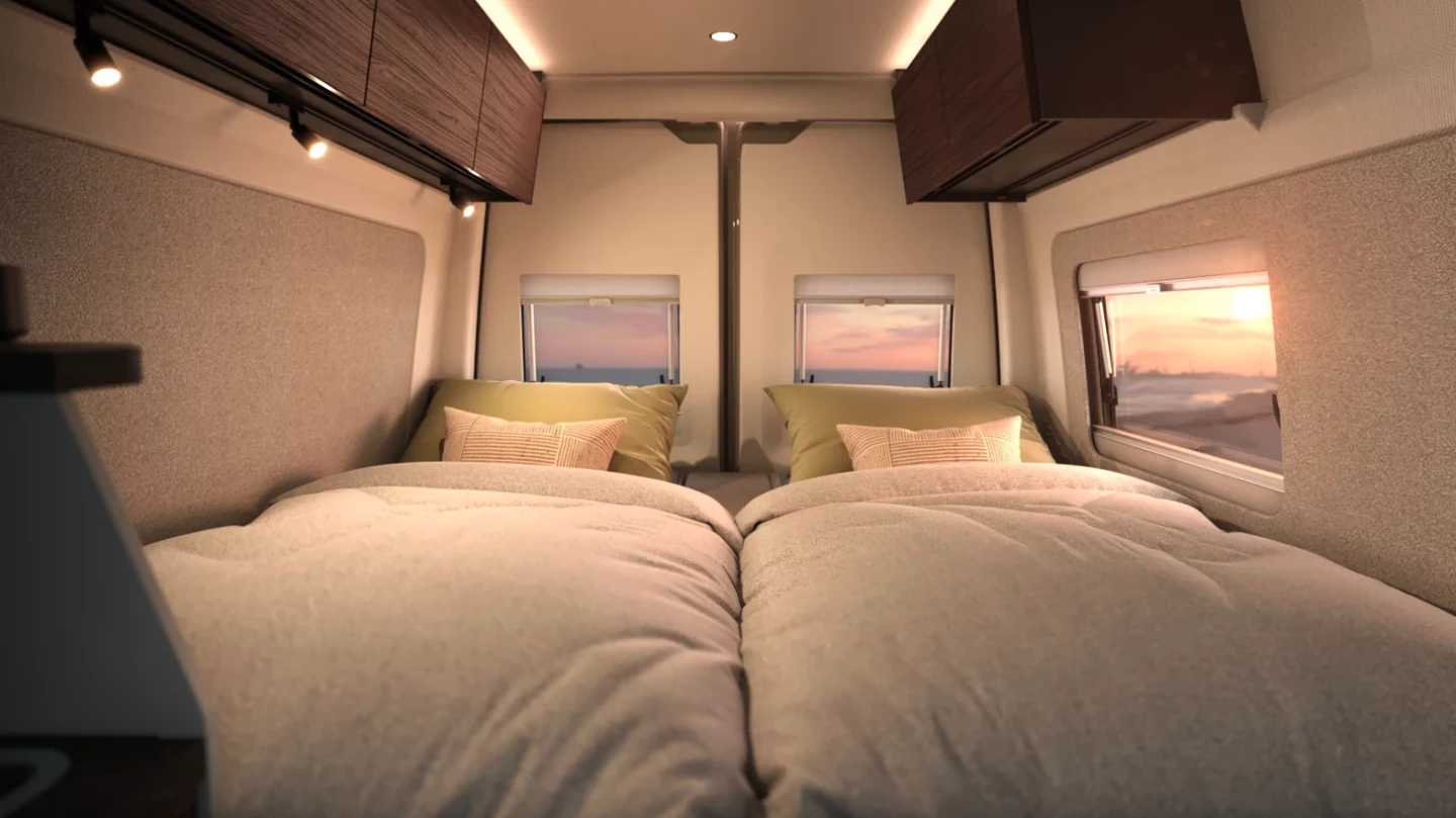 Two single longitudinal beds in a short Mercedes Sprinter van serve as the big benefit of the sliding bathroom design