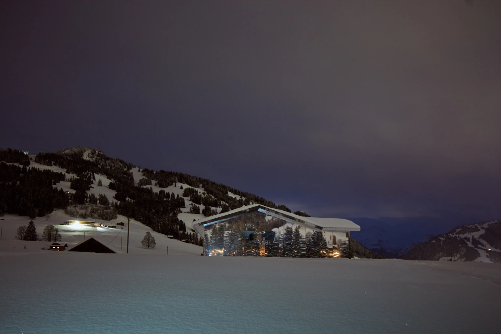 "As Mirage Gstaad pulls the landscape in and reflects it back out, this classic one-story suburban house becomes a framing device, a perceptual echo-chamber endlessly bouncing between the dream of nature as pure uninhabited state and the pursuit of its conquest," says the press release